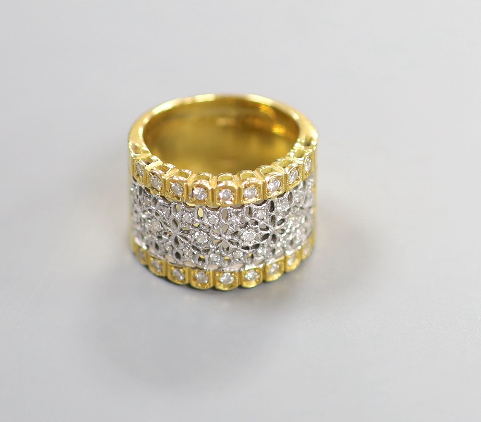 A modern pierced 750 yellow metal and diamond chip set dress ring, size M/N